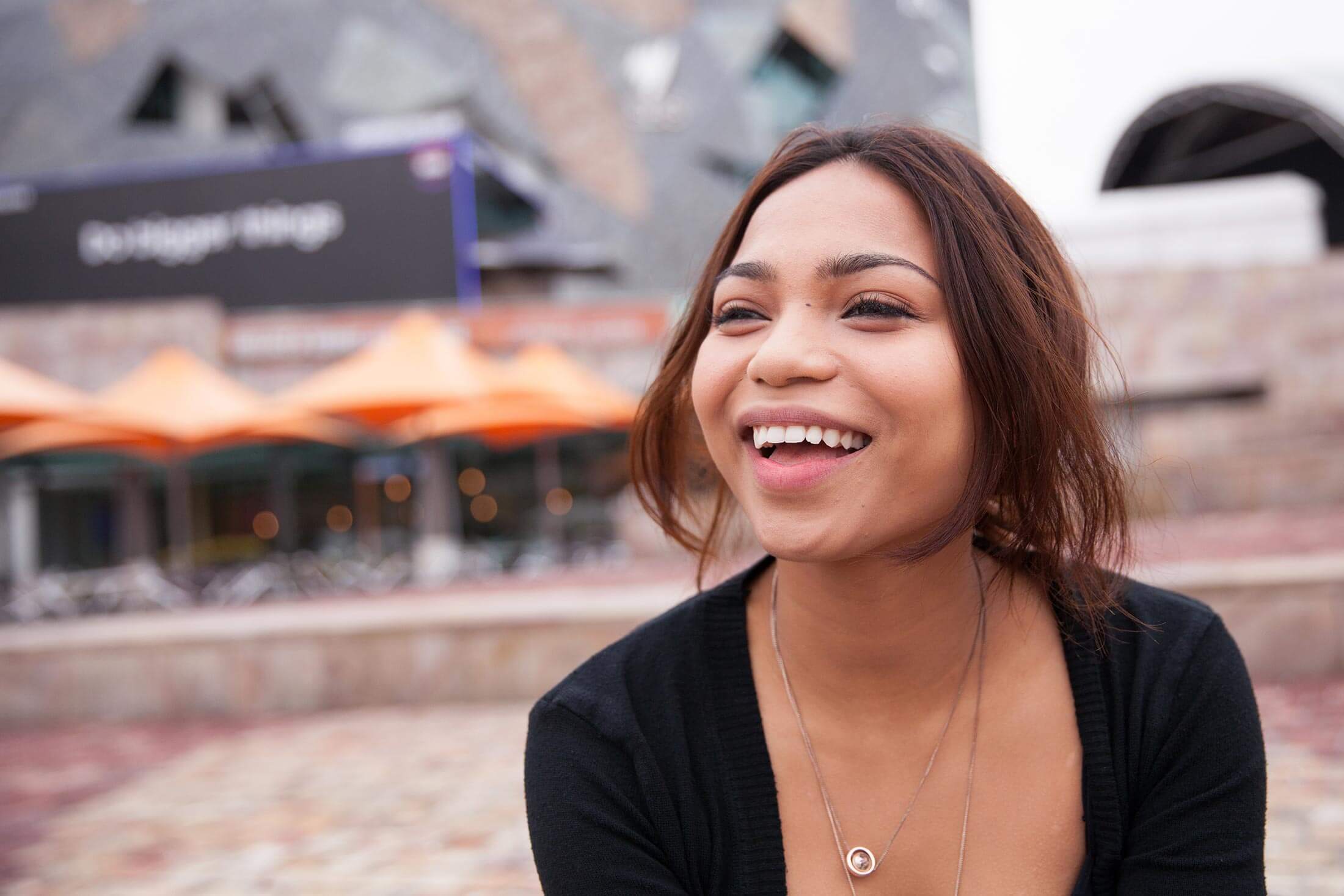 Woman laughing at Fed Square